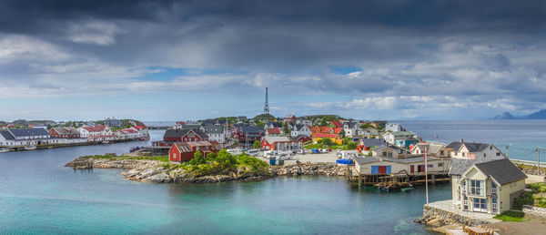 Panoramic view of sea and buildings against sky