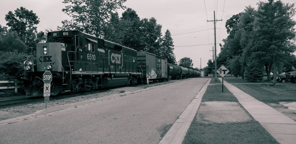 Train on railroad track against sky