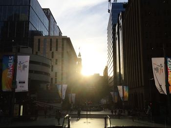 Sun shining through buildings