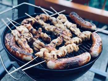 High angle view of meat in barbecue grill