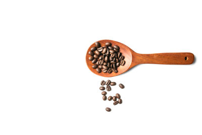 Close-up of coffee beans against white background