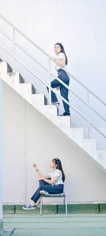 Young couple sitting on staircase