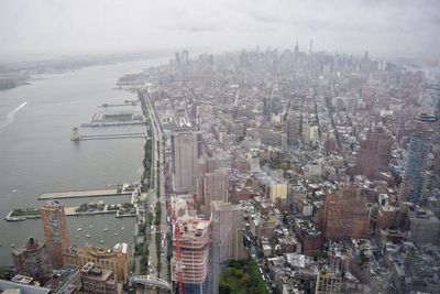 High angle view of river amidst buildings in city