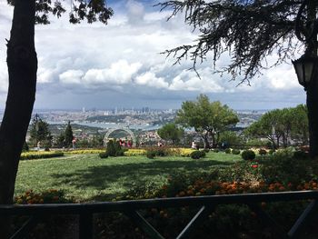 View of town against cloudy sky