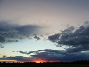 Low angle view of silhouette trees against sky during sunset