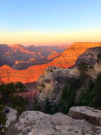 Scenic view of mountains against clear sky during sunset