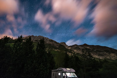 Scenic view of mountains against sky at night