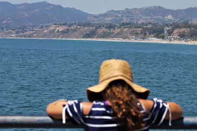 Rear view of woman looking at sea