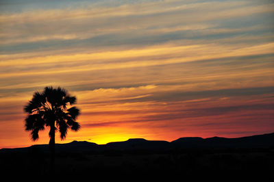 Silhouette of landscape against dramatic sky