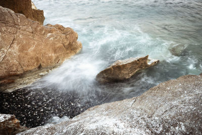 Scenic view of rocks in sea