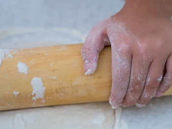 Close-up of person preparing food on table