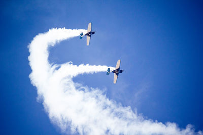 Low angle view of airplane flying in sky