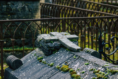 Close-up of metallic bridge in cemetery