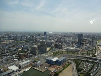 High angle view of buildings in city against sky