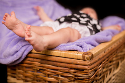 Close-up of baby girl in cradle