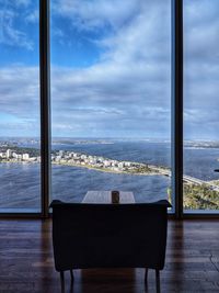 Scenic view of sea seen through glass window