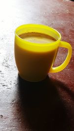 Close-up of yellow drink on table