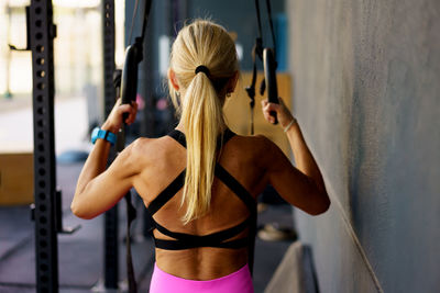 Young woman exercising at gym