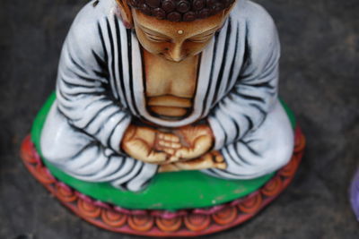 High angle view of woman sitting outdoors