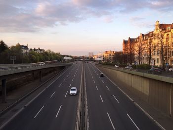 Vehicles on road along buildings