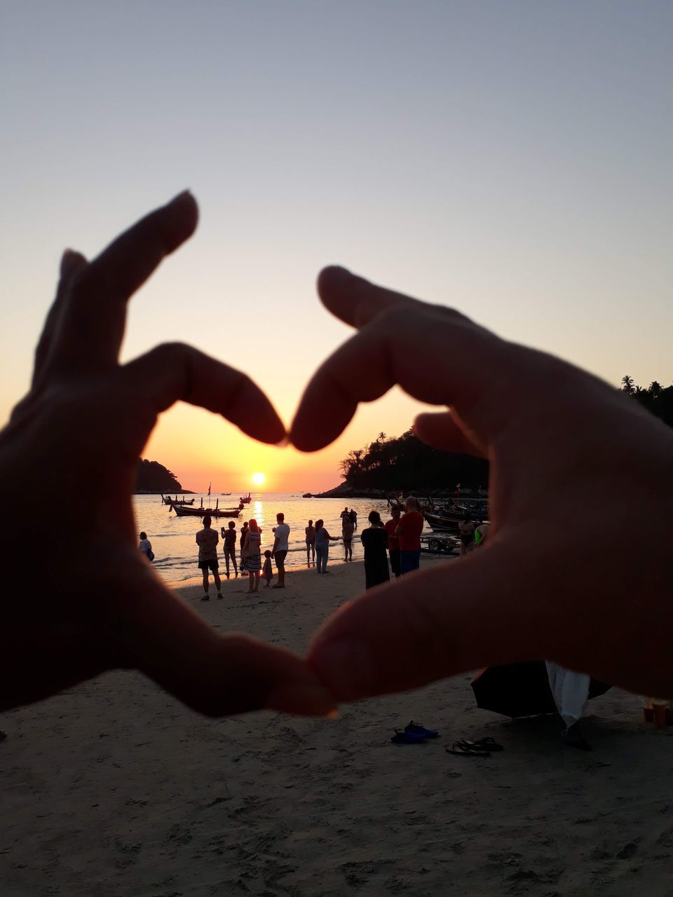 hand, sky, beach, nature, sunset, adult, land, silhouette, togetherness, leisure activity, positive emotion, group of people, women, sand, love, emotion, lifestyles, holiday, men, friendship, vacation, trip, outdoors, clear sky, light, water, sea, bonding, person, celebration, sunlight, enjoyment, crowd