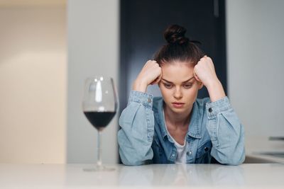 Portrait of young woman holding wineglass