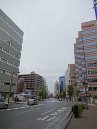Buildings in city against clear sky