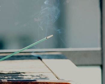 Burning incense stick with smoke