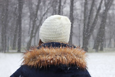 Close-up portrait of woman in snow