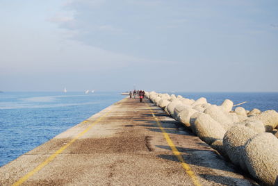 Pier over sea against sky