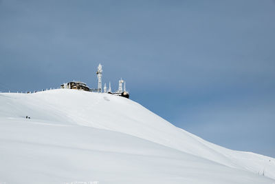 Low angle view of snow on mountain against sky