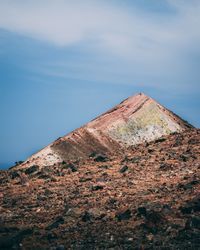 Low angle view of rock formation against sky