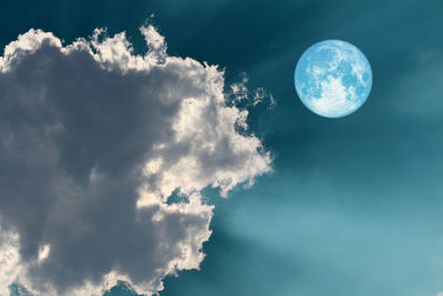 Low angle view of full moon in sky