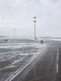 Snow covered road against sky