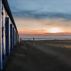 Scenic view of beach against sky during sunset