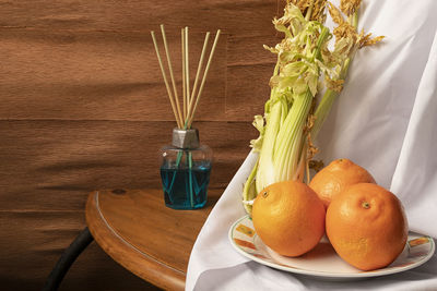 Close-up of oranges on table