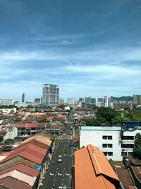 High angle view of buildings in city against sky