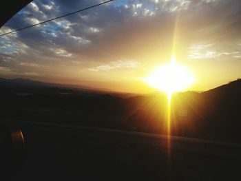 Scenic view of landscape against sky during sunset