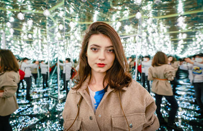 Young woman in mirror maze