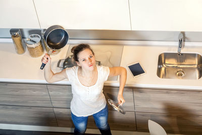 Full length of woman standing at home