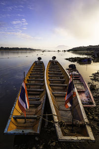 Boats moored at harbor