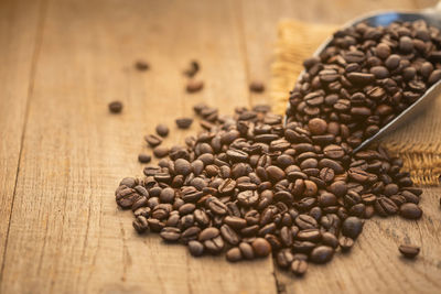 Close-up of roasted coffee beans on table