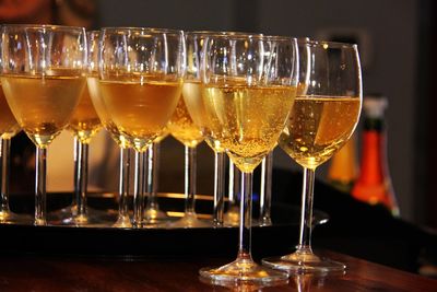 Close-up of wine glasses on table