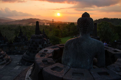 Statue against sky during sunset