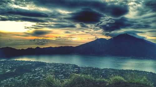 Scenic view of mountains against dramatic sky