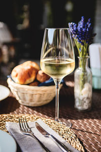 Glass of cold white wine and fresh pastries
