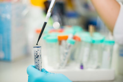 Cropped hands of scientist experimenting in laboratory