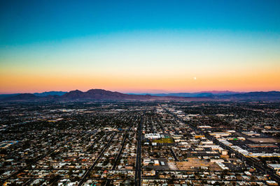 High angle view of townscape against sky at sunset