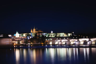 Night view of old town of prague with prague castle andpopular tourist attraction with prague bridge