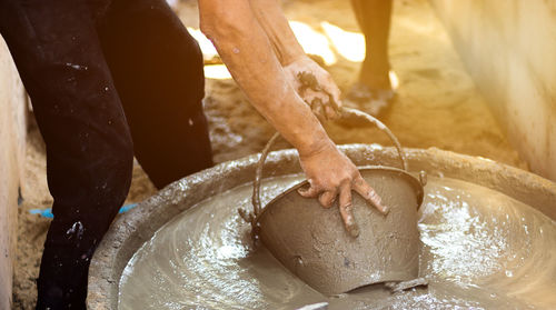 Midsection of person preparing food